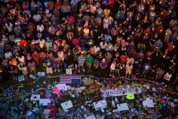 Mourners attend a candlelight vigil in Orlando